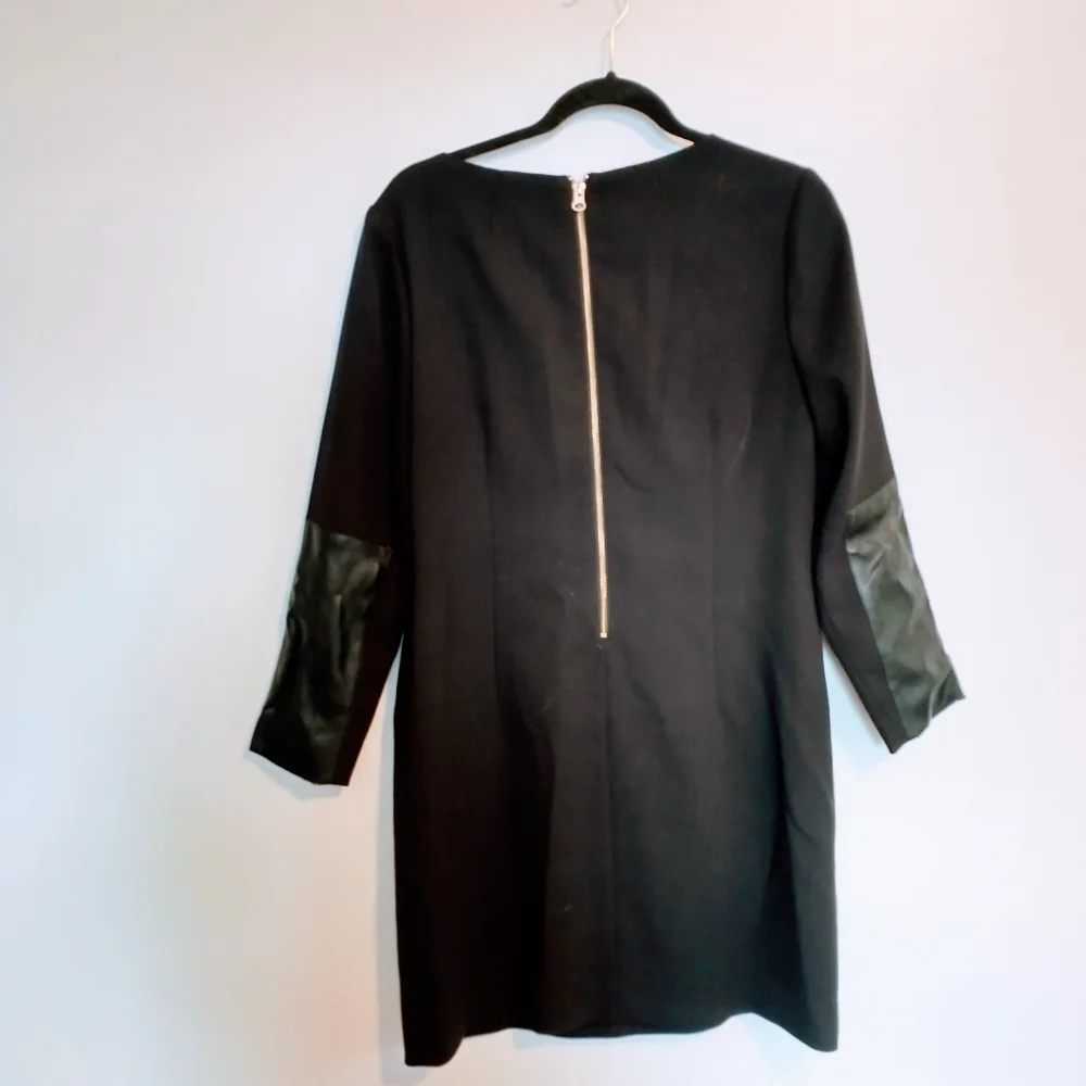 J Crew shift black dress with gold zipper detailing. Size 8, leather elbow patch